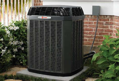 photo of air-conditioning unit installed outside of a home