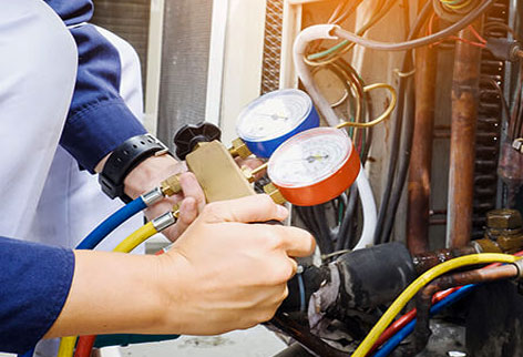 photo of furnace technician using testing equipment